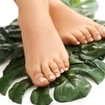 bare-feet-on-leaves-foot-care-and-pedicure-concept