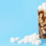 front-view-glass-soft-drink-with-sugar-cubes-copy-space