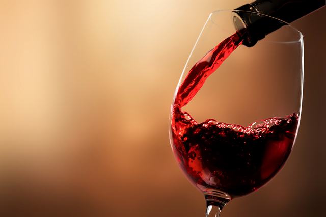 red-wine-pouring-from-bottle-glass