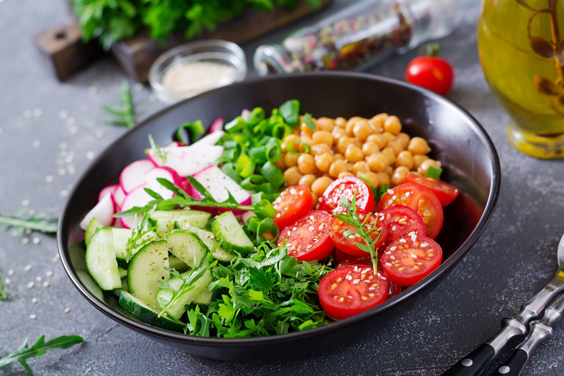 salad-of-chickpeas-tomatoes-cucumbers-radish-and-greens-dietary-food-buddha-bowl-vegan-salad