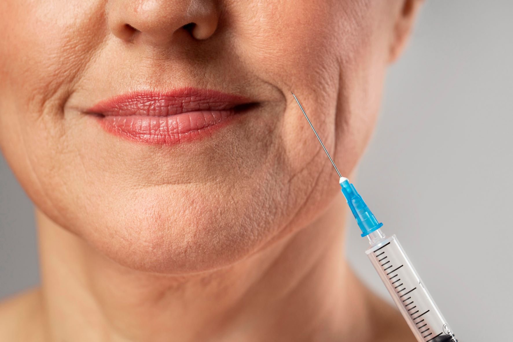 smiley-elder-woman-using-injection-her-mouth-wrinkles